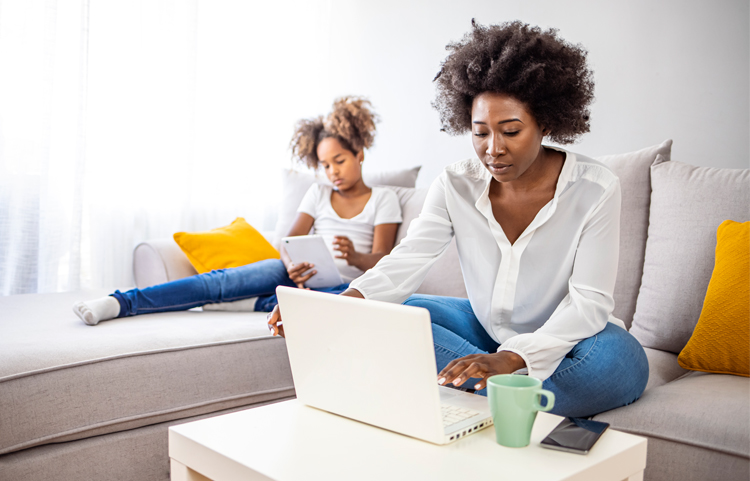 Mother looking things up on a computer